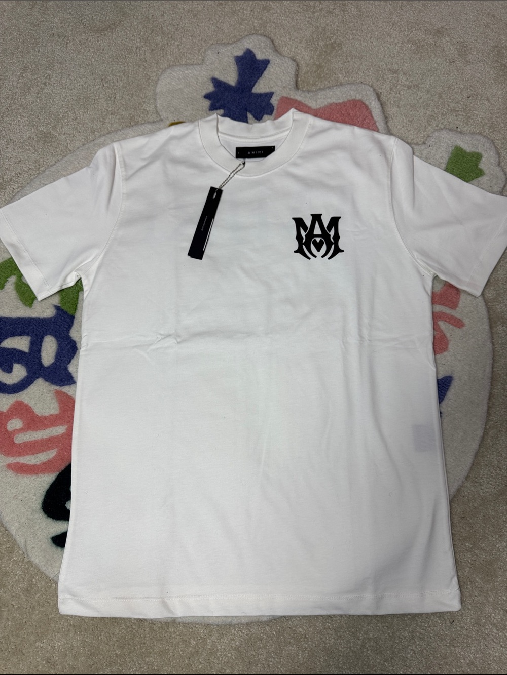 AMIRI White Short Sleeve Tee with Black Logo Chest Graphic